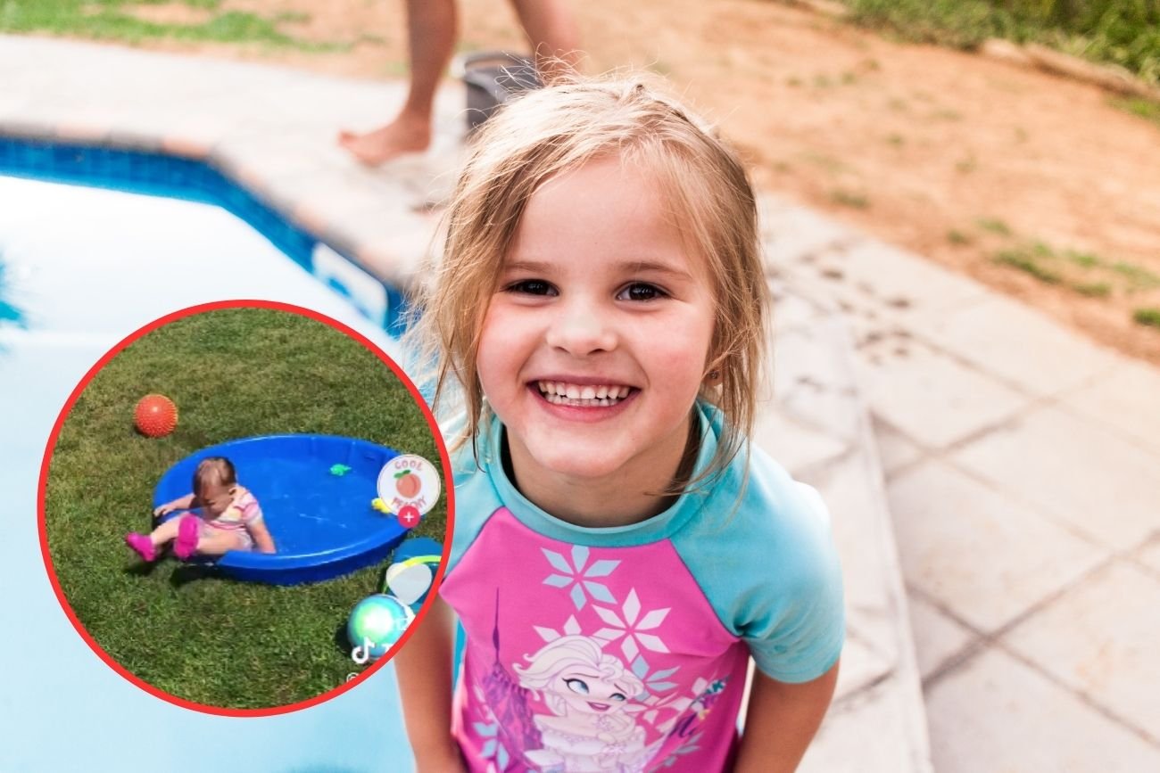 Mała dziewczynka bawiąca się na basenie.